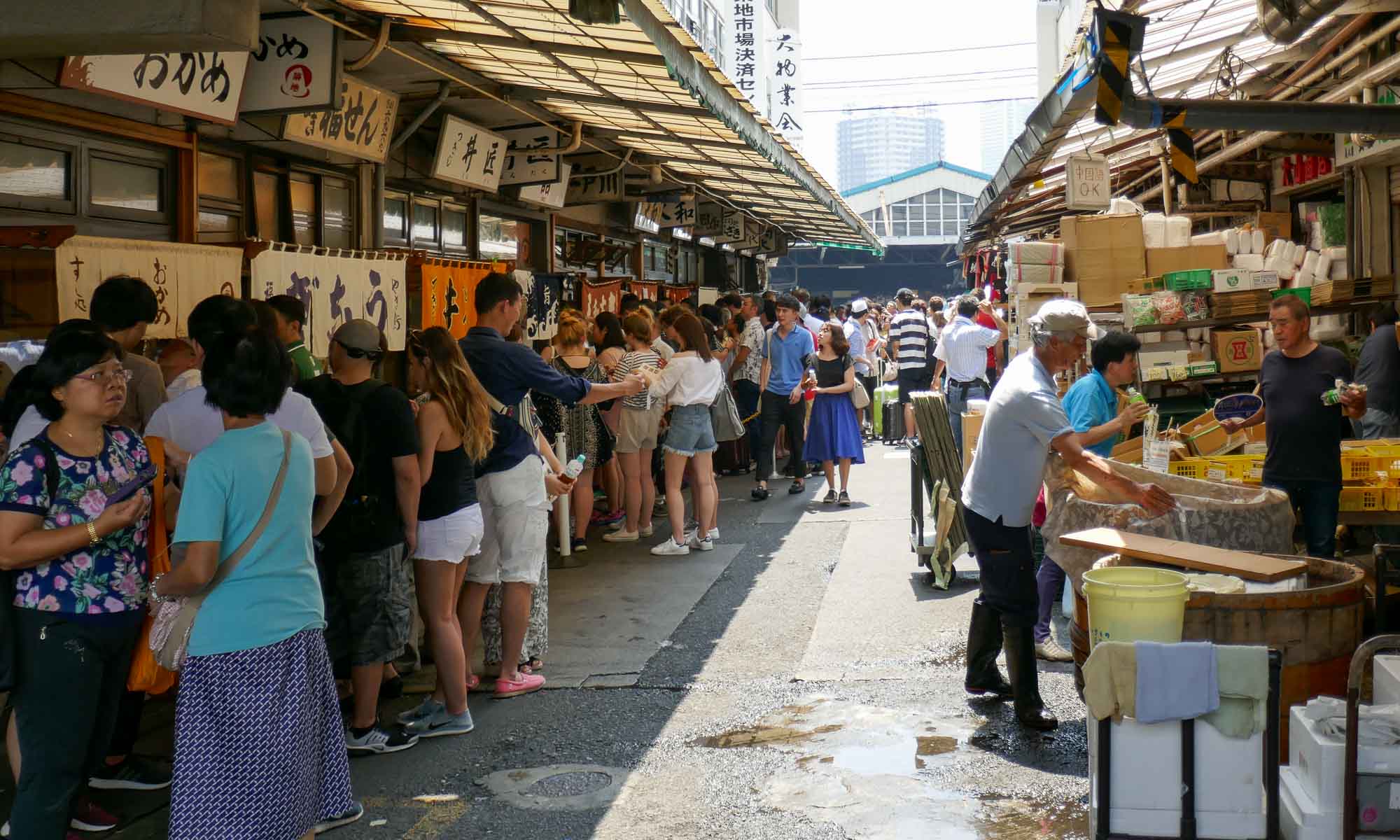People waiting to be seated at sushi restaurants at the Tsukiji Fish Market