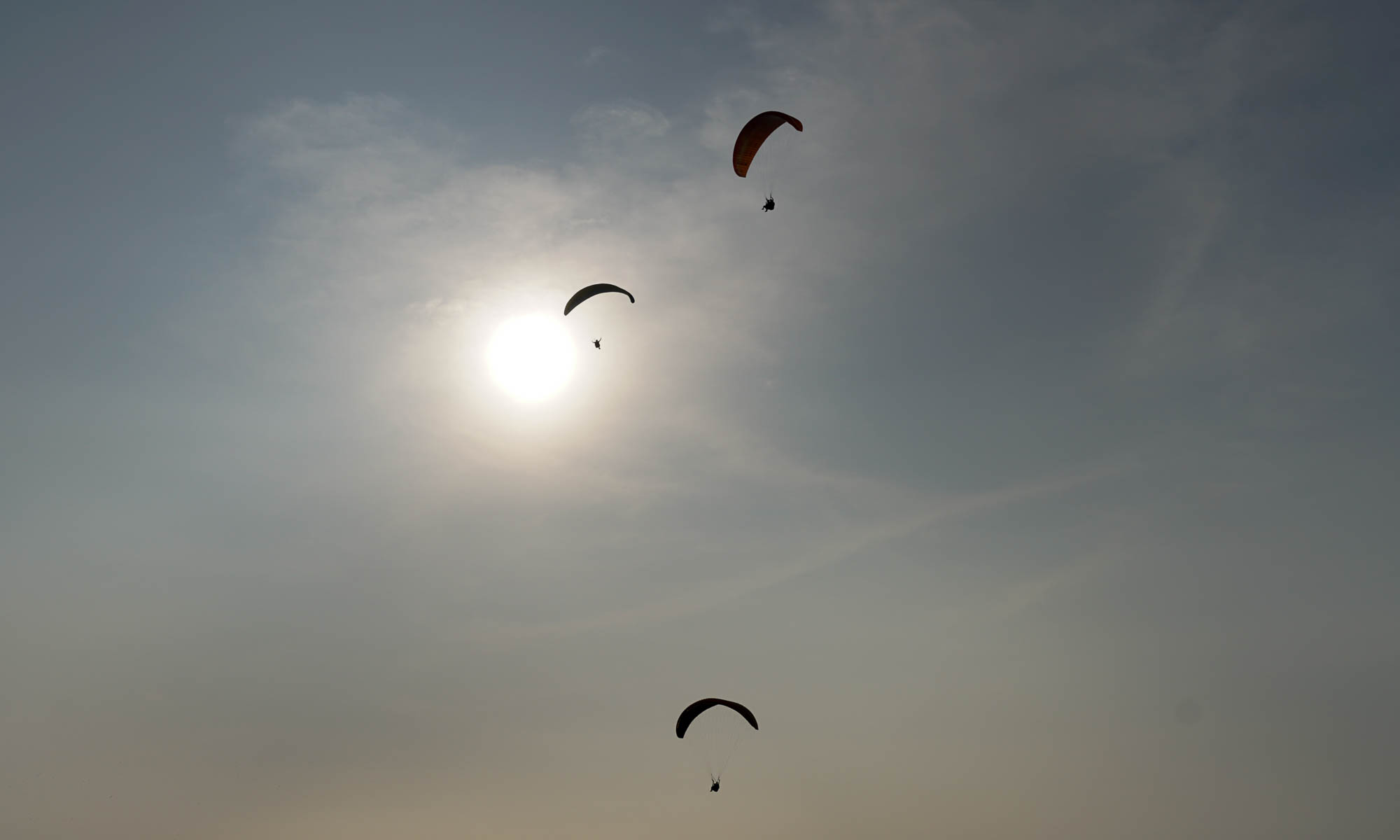 Paragliders above Lima's coast